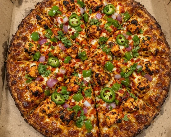Spicy paneer pizza with tandoori paneer, green chilies, green peppers and red onion